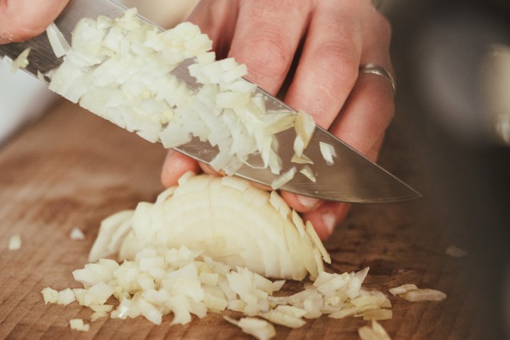 a person dicing food