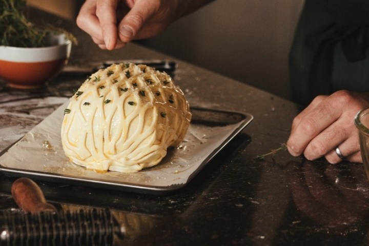 a person putting food on a table